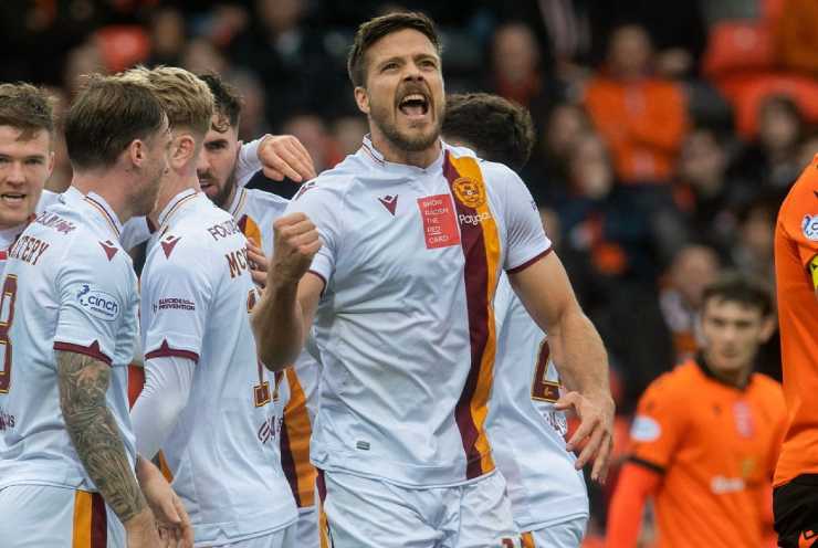 Motherwell players cheer after a goal