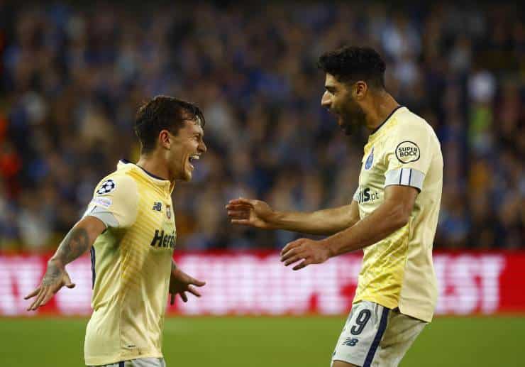 Taremi (right) exults after a goal