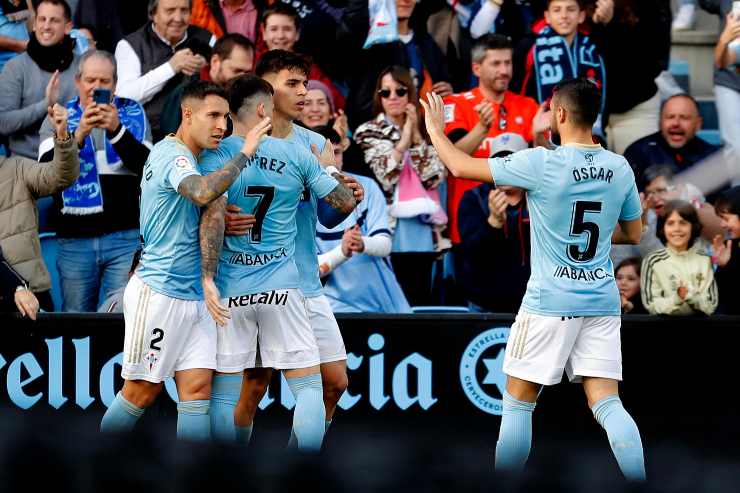 Celta Vigo players exult after a goal