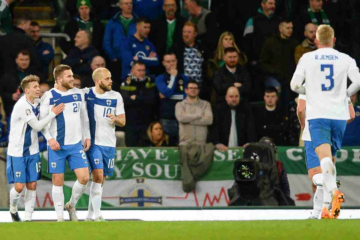 Finnish players exult after a goal