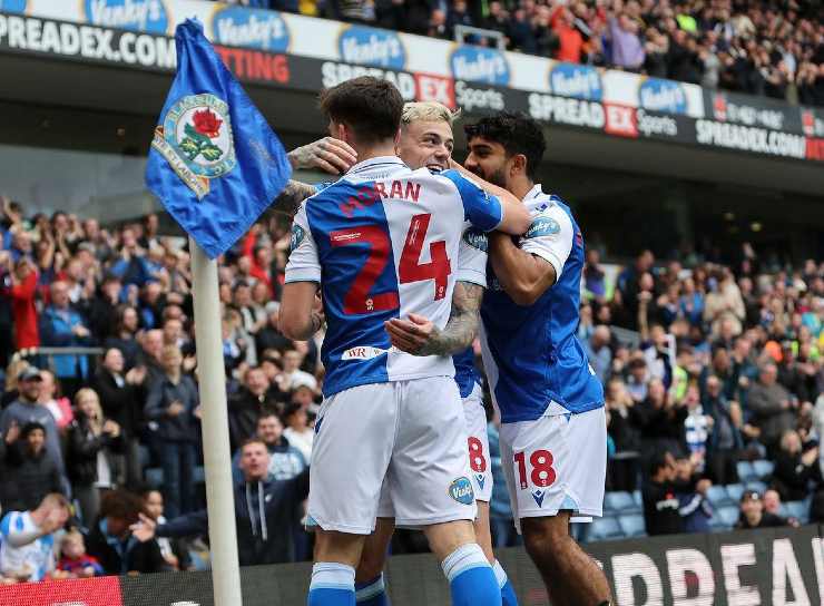 Blackburn players cheer after a goal